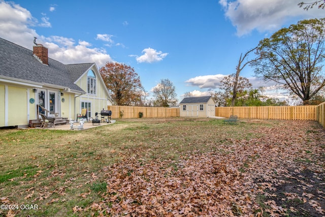 607 S Morgan Ct, Joplin, MO 64801 - view of yard with a patio, a fenced backyard, entry steps, and a shed