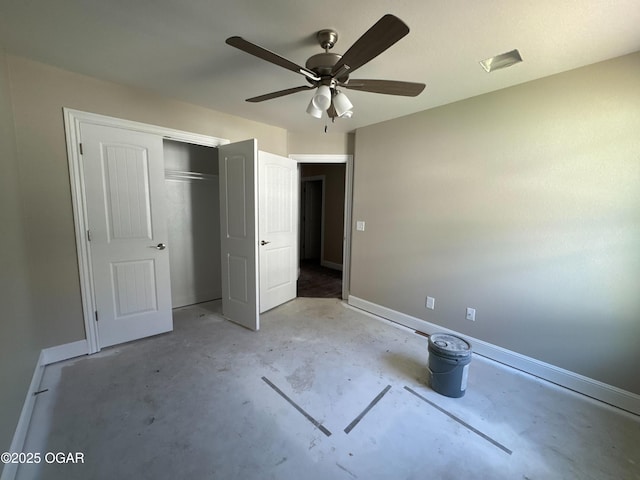 unfurnished bedroom with baseboards, a closet, ceiling fan, and unfinished concrete flooring