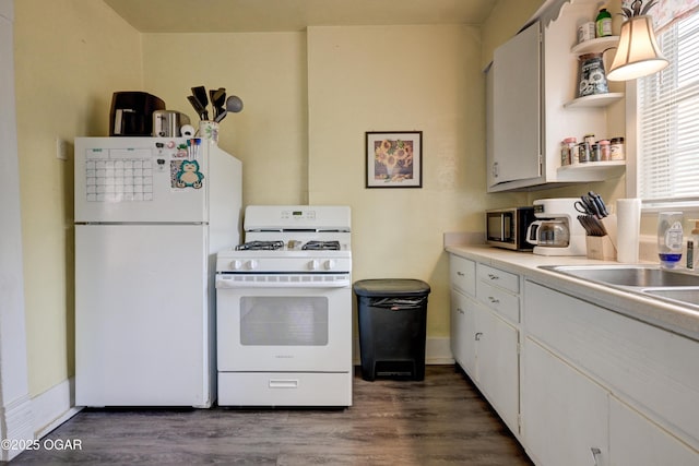 kitchen featuring open shelves, white appliances, light countertops, dark wood finished floors, and white cabinetry