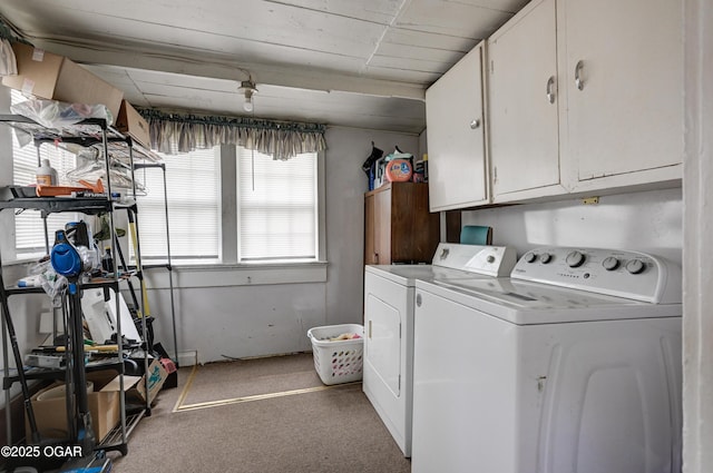 clothes washing area featuring cabinet space, independent washer and dryer, and carpet flooring