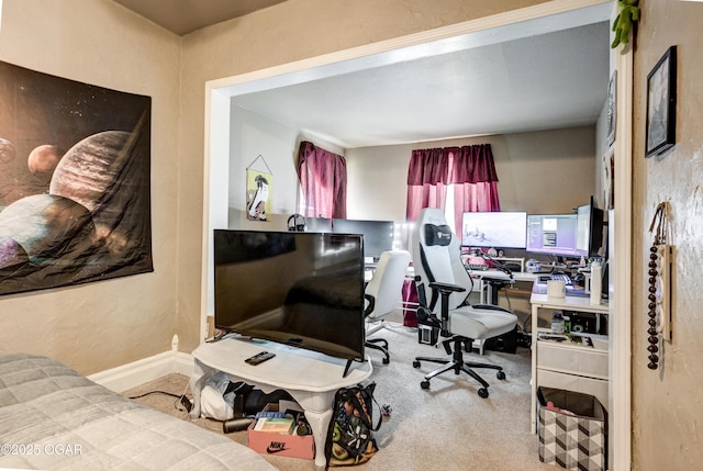carpeted home office with baseboards