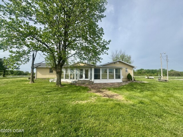 29288 Norway Rd, Stark City, MO 64866 - back of property featuring a lawn, a sunroom, and french doors