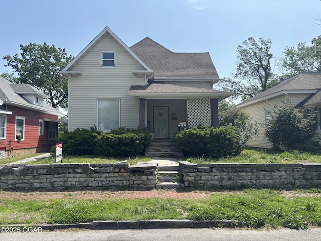 429 N Wall Ave, Joplin, MO 64801 - view of front facade featuring covered porch and roof with shingles