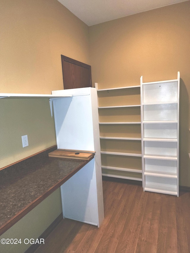 305 E Maple St, Liberal, MO 64762 - spacious closet featuring wood finished floors