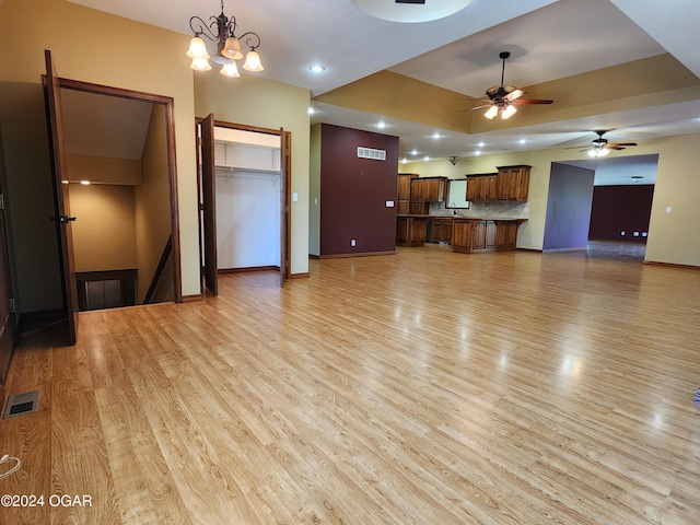 305 E Maple St, Liberal, MO 64762 - unfurnished living room with baseboards, visible vents, ceiling fan, and light wood finished floors