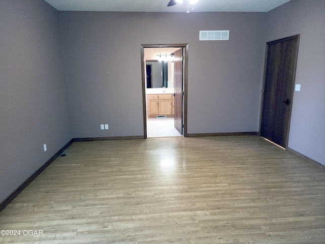 305 E Maple St, Liberal, MO 64762 - unfurnished room with ceiling fan, baseboards, light wood-style floors, and visible vents