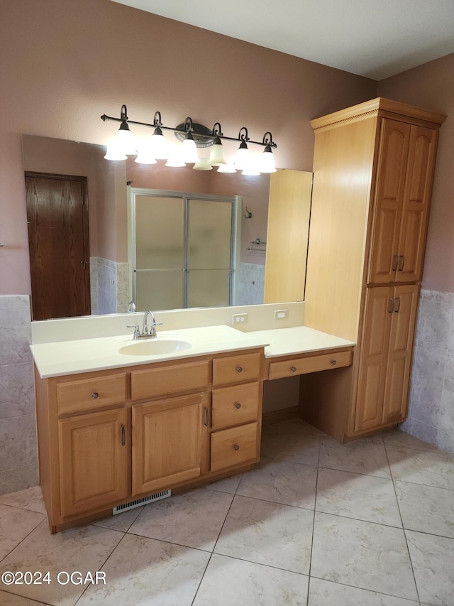 305 E Maple St, Liberal, MO 64762 - bathroom with visible vents, a stall shower, tile patterned flooring, and vanity