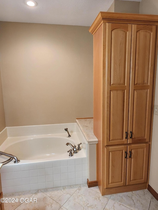 305 E Maple St, Liberal, MO 64762 - bathroom with baseboards, a garden tub, and marble finish floor