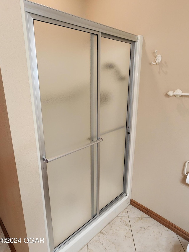 305 E Maple St, Liberal, MO 64762 - full bath featuring a shower stall and baseboards