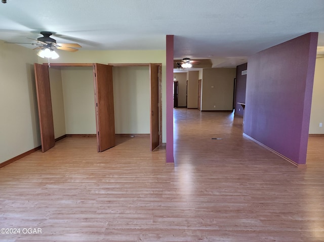 305 E Maple St, Liberal, MO 64762 - interior space featuring ceiling fan, baseboards, and light wood-type flooring