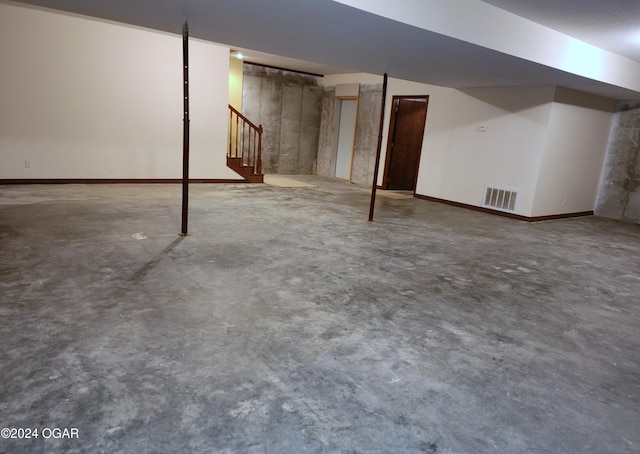305 E Maple St, Liberal, MO 64762 - finished basement featuring stairs, visible vents, and baseboards
