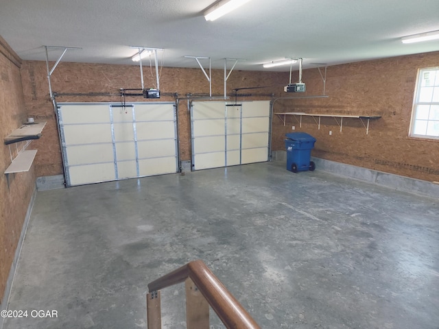 305 E Maple St, Liberal, MO 64762 - garage featuring a garage door opener