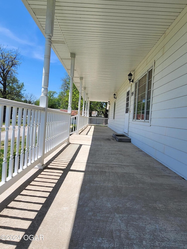 305 E Maple St, Liberal, MO 64762 - view of patio / terrace with covered porch