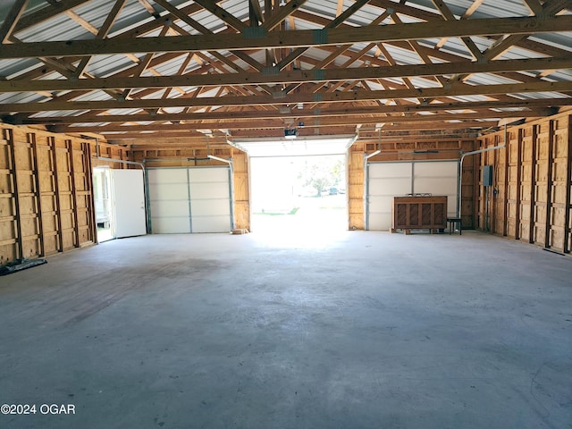 305 E Maple St, Liberal, MO 64762 - garage with a garage door opener