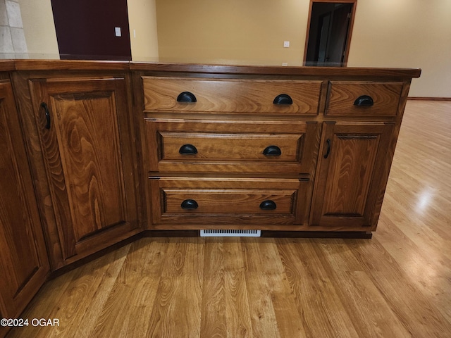 305 E Maple St, Liberal, MO 64762 - interior details with wood finished floors and visible vents