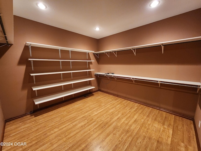 305 E Maple St, Liberal, MO 64762 - walk in closet featuring light wood-style floors