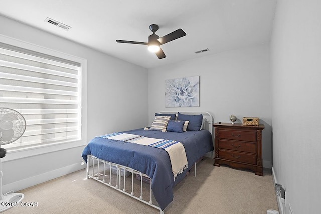 bedroom featuring carpet floors, a ceiling fan, and baseboards