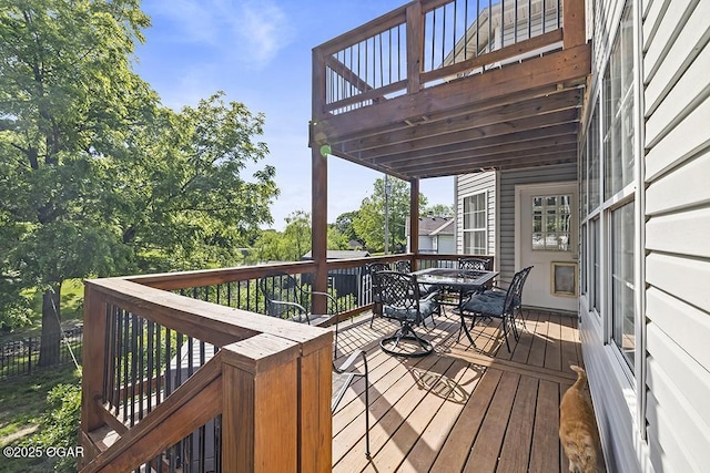 wooden deck with outdoor dining area