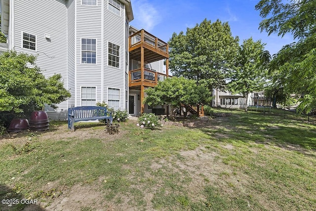 rear view of property with a balcony