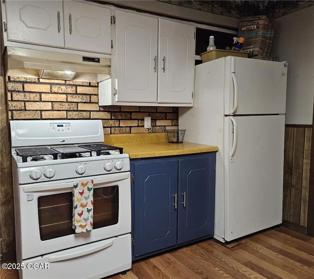 105 S Elm St, Mulberry, KS 66756 - kitchen with white appliances, light countertops, wood finished floors, under cabinet range hood, and blue cabinets