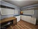 105 S Elm St, Mulberry, KS 66756 - interior space with wood finished floors