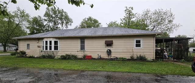 105 S Elm St, Mulberry, KS 66756 - rear view of house with a lawn