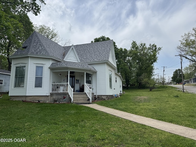 301 S 7th St, Sarcoxie, MO 64862 - victorian house with a porch, roof with shingles, and a front yard