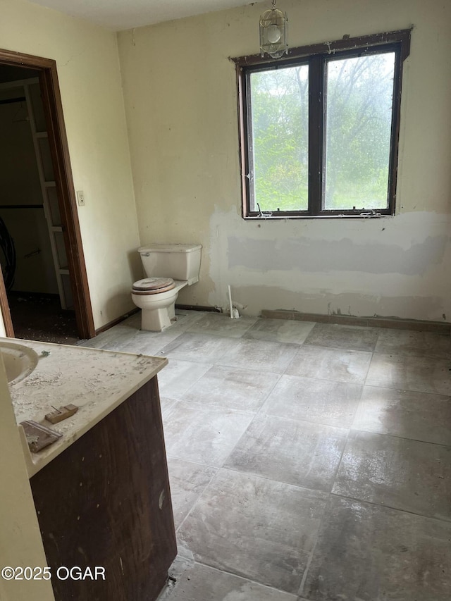 bathroom featuring toilet and vanity
