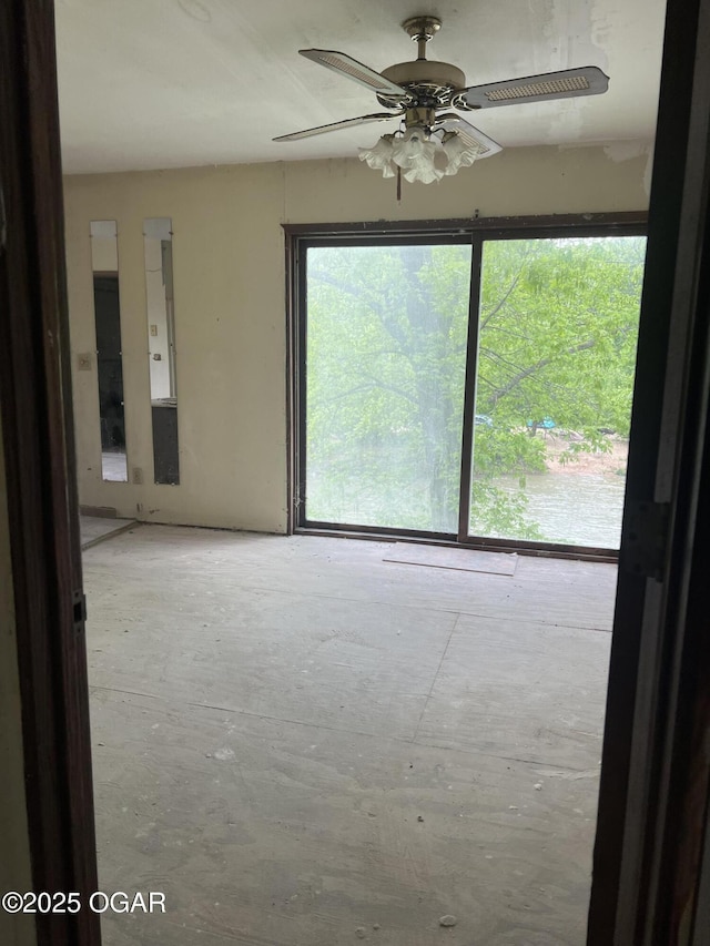spare room with a ceiling fan