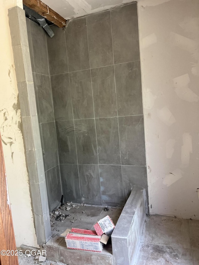 full bathroom with a tile shower