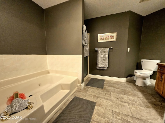 2921 E Matthews Dr, Joplin, MO 64801 - full bath featuring a tub with jets, baseboards, a stall shower, and toilet