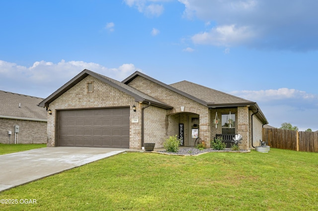 354 Sidney Ln, Webb City, MO 64870 - french country home with fence, brick siding, a garage, a front yard, and driveway