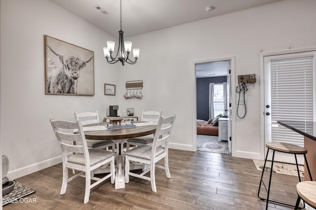 354 Sidney Ln, Webb City, MO 64870 - dining space with an inviting chandelier, baseboards, dark wood-style flooring, and visible vents