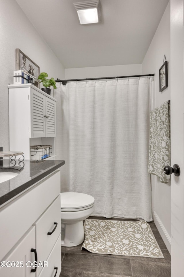 354 Sidney Ln, Webb City, MO 64870 - bathroom featuring vanity, a shower with shower curtain, wood finished floors, and toilet