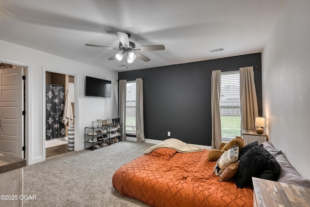 354 Sidney Ln, Webb City, MO 64870 - bedroom with visible vents, carpet flooring, a ceiling fan, and multiple windows