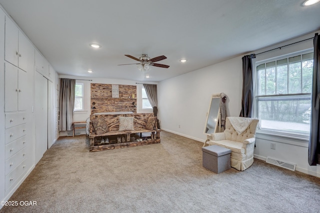 carpeted bedroom featuring baseboards, ceiling fan, recessed lighting, and visible vents