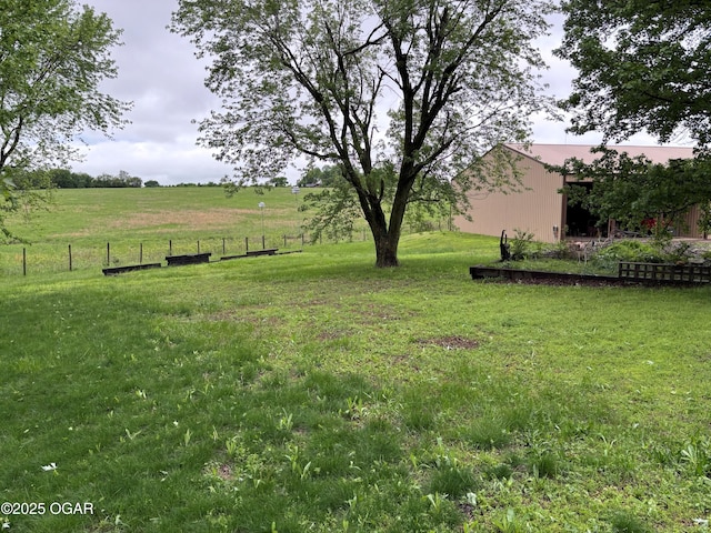 1208 S Blackcat Rd, Joplin, MO 64801 - view of yard with a pole building, fence, an outbuilding, and a rural view