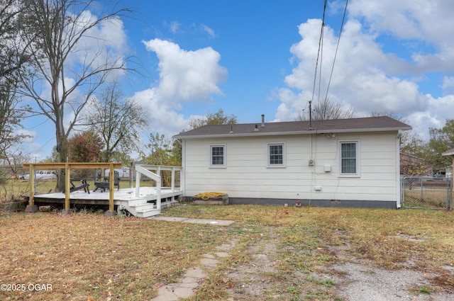 1713 Indiana Ave, Joplin, MO 64804 - back of property featuring a deck, fence, and crawl space