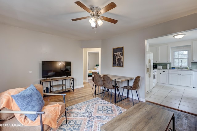 1713 Indiana Ave, Joplin, MO 64804 - living area with baseboards, light wood-type flooring, and ceiling fan