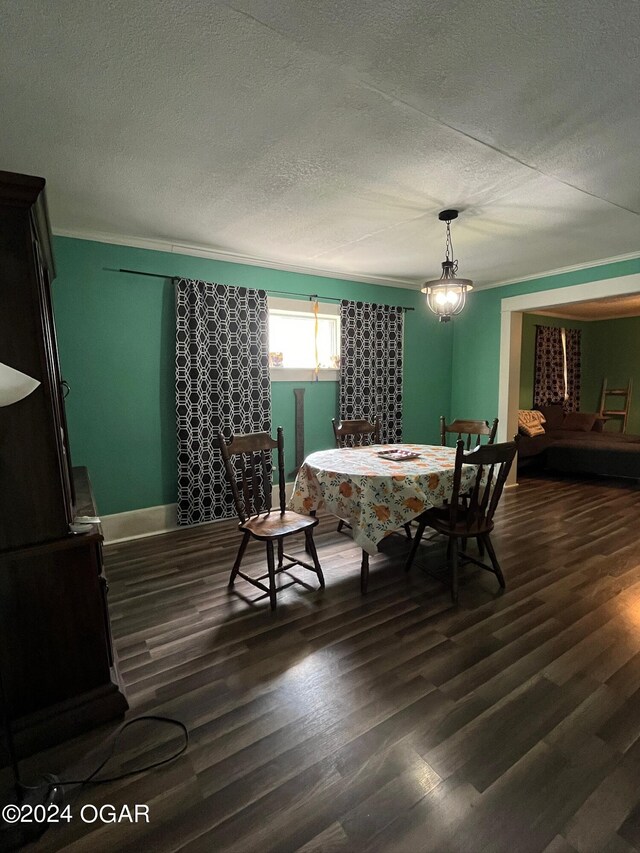 1715 S Kentucky Ave, Joplin, MO 64804 - dining space featuring dark wood-style floors, a textured ceiling, crown molding, and baseboards