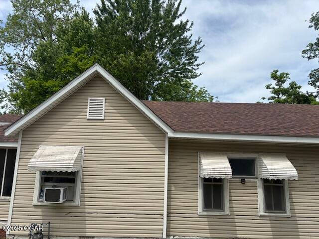 1715 S Kentucky Ave, Joplin, MO 64804 - view of side of property with cooling unit and roof with shingles