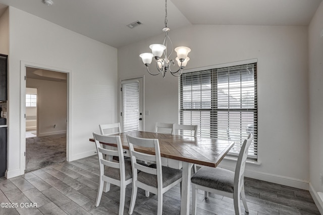 1810 Boyer Pl, Webb City, MO 64870 - dining space featuring vaulted ceiling, a chandelier, wood finished floors, and baseboards