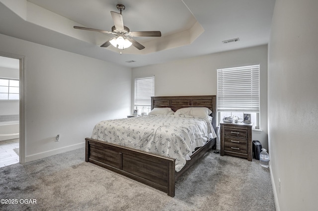 1810 Boyer Pl, Webb City, MO 64870 - carpeted bedroom featuring baseboards, a raised ceiling, and a ceiling fan