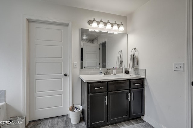 1810 Boyer Pl, Webb City, MO 64870 - bathroom featuring vanity, wood finished floors, and baseboards