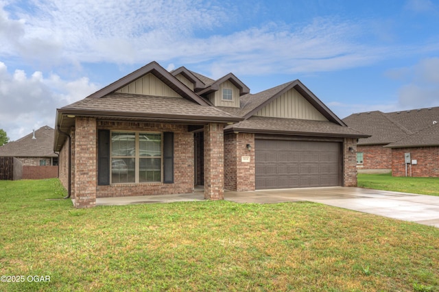 1810 Boyer Pl, Webb City, MO 64870 - view of front of house with driveway, board and batten siding, an attached garage, and brick siding