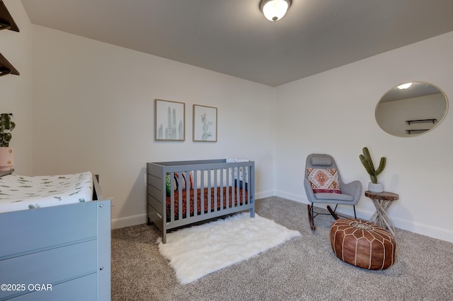 bedroom with baseboards and carpet flooring
