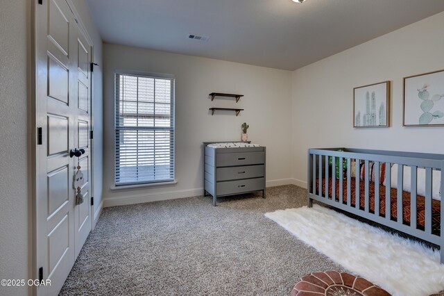 1814 Fountain Rd, Webb City, MO 64870 - carpeted bedroom featuring baseboards, a nursery area, and visible vents