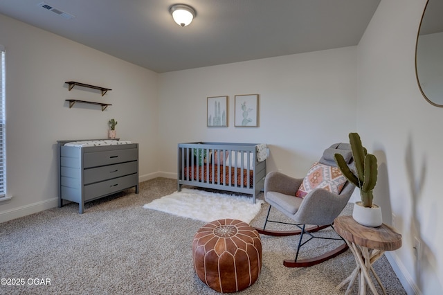 carpeted bedroom with baseboards and visible vents