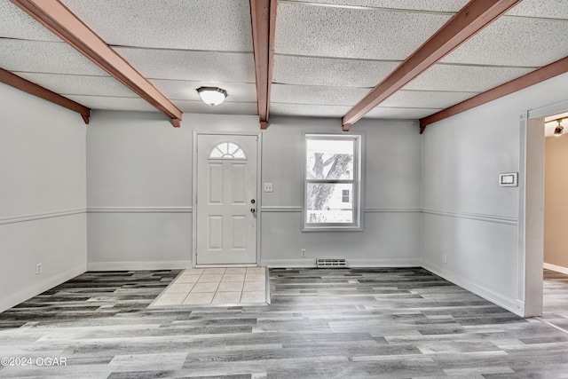 530 N Joplin Ave, Joplin, MO 64801 - entrance foyer with baseboards, visible vents, beam ceiling, and wood finished floors