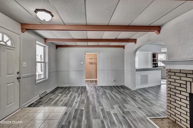 530 N Joplin Ave, Joplin, MO 64801 - foyer entrance featuring arched walkways, beamed ceiling, and visible vents
